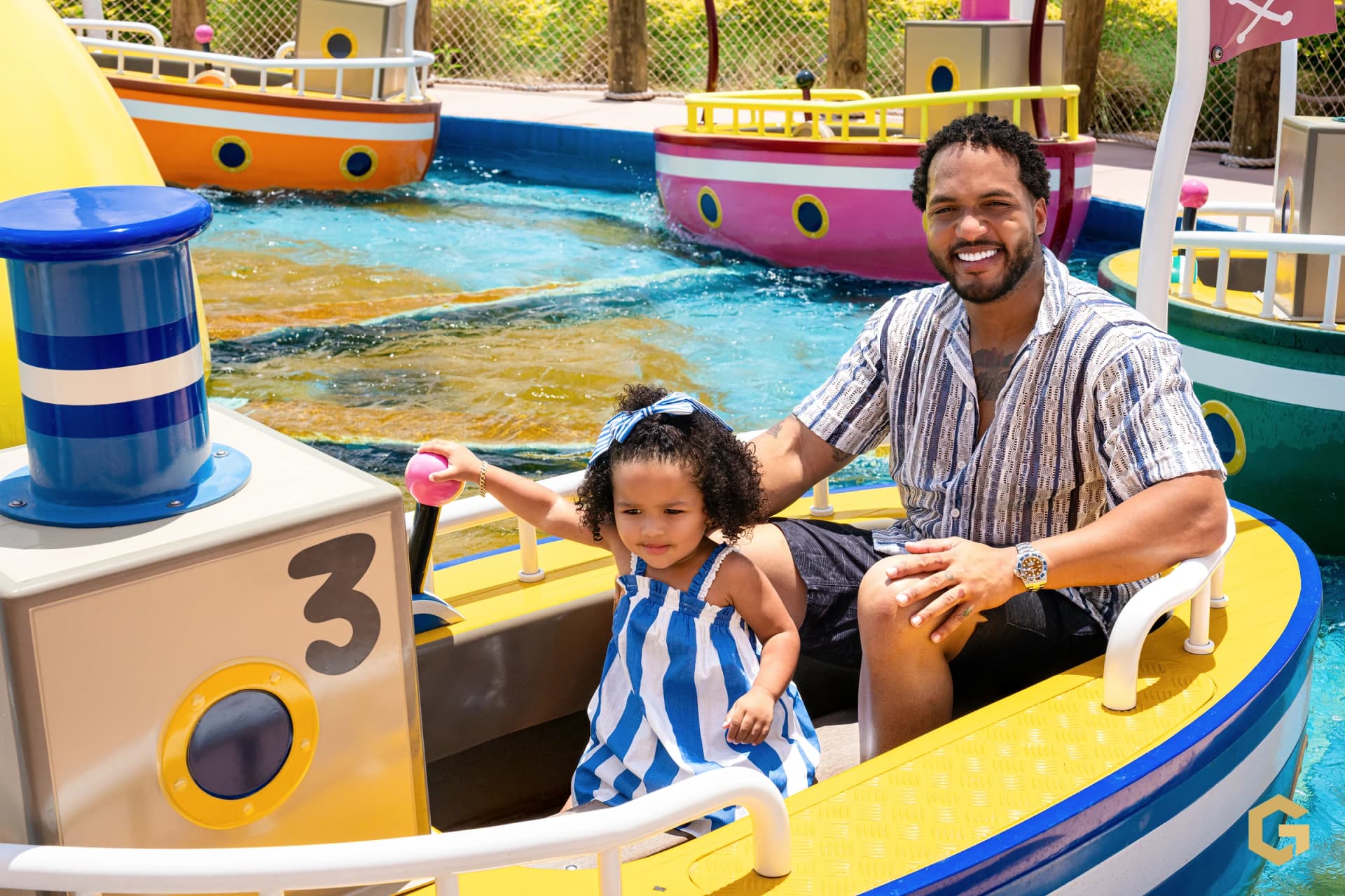 Edgardo and his daughter sharing a colorful boat ride
