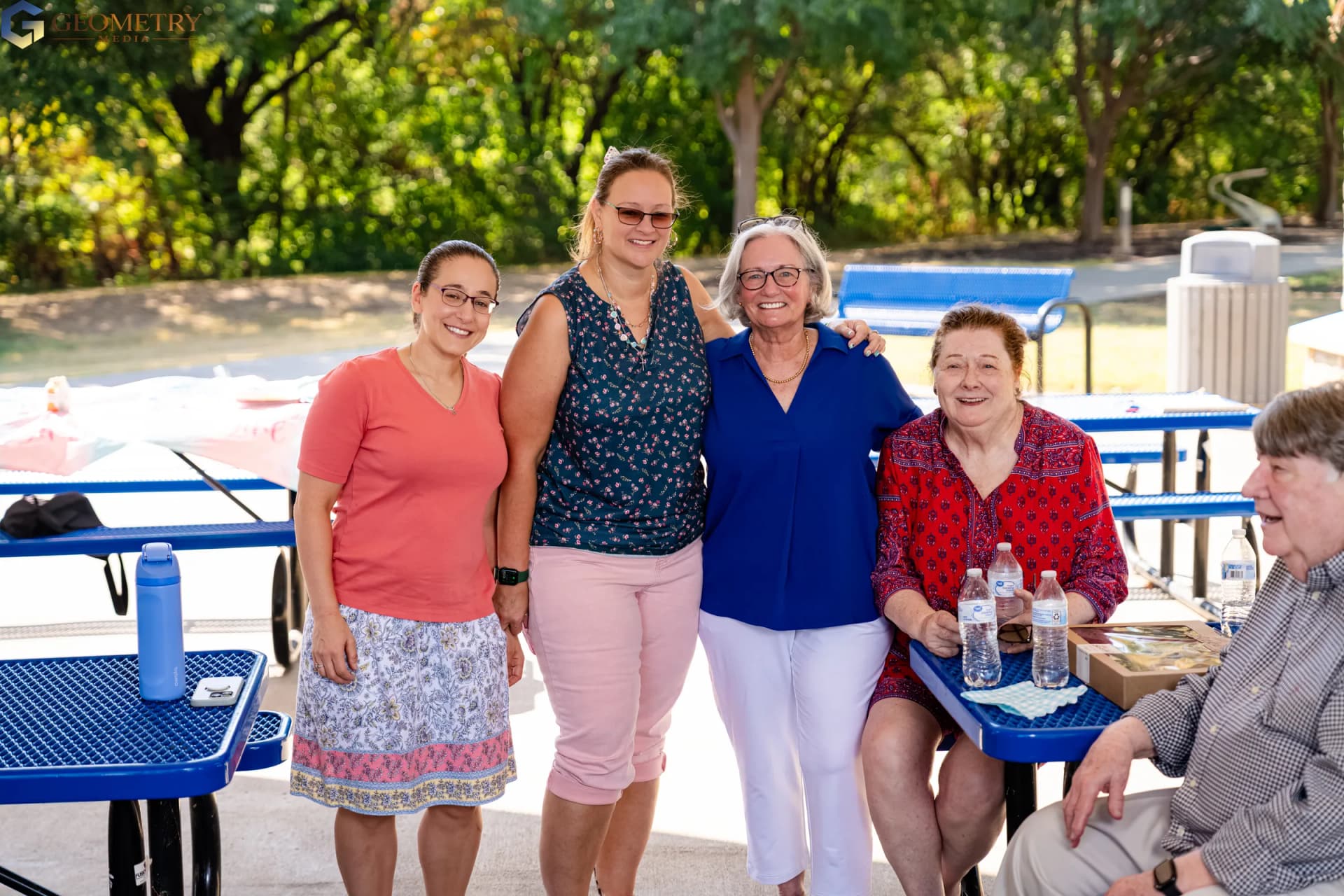 Four generations of family smile together during the celebration