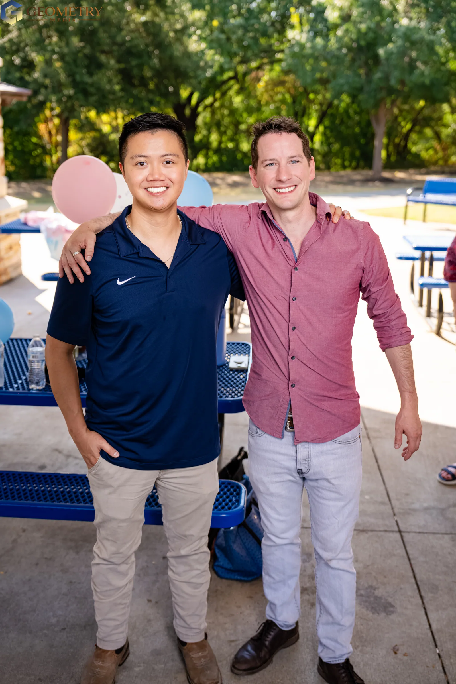 Father-to-be poses with a friend at the celebration