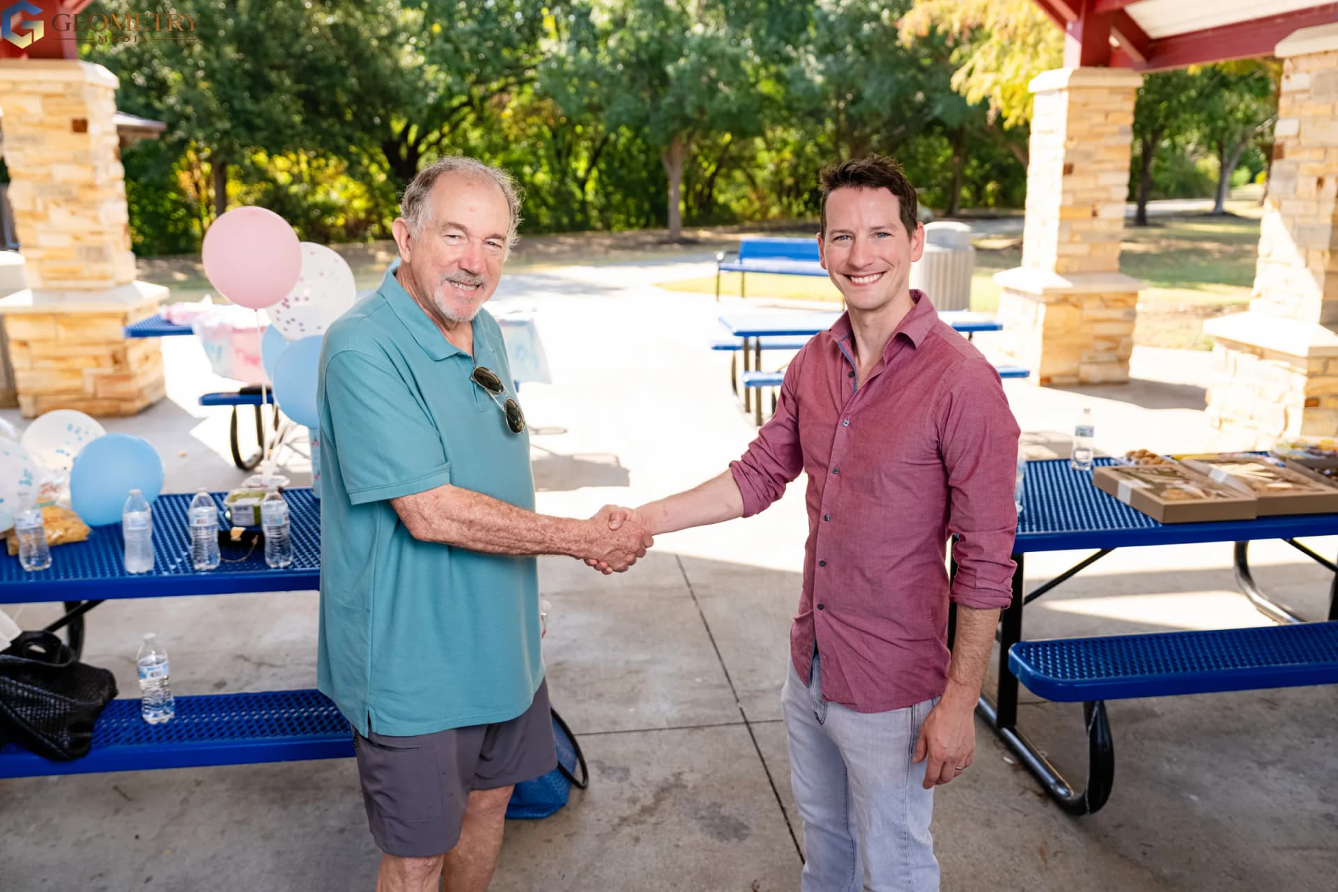Father-to-be greets a family member with a handshake
