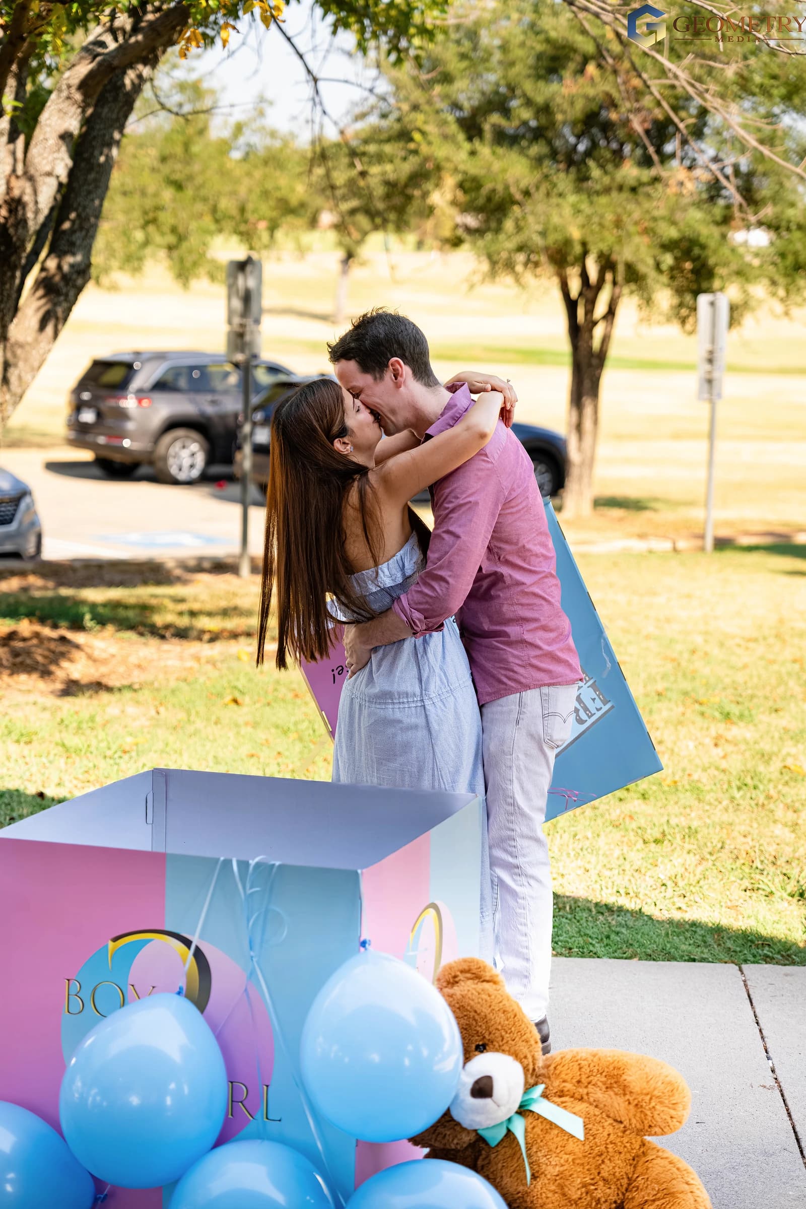 A kiss and an embrace after the gender reveal