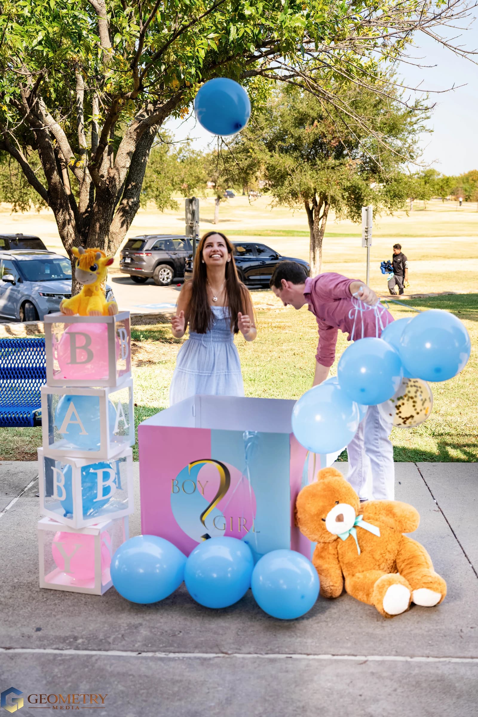 Laughter beneath a floating blue balloon