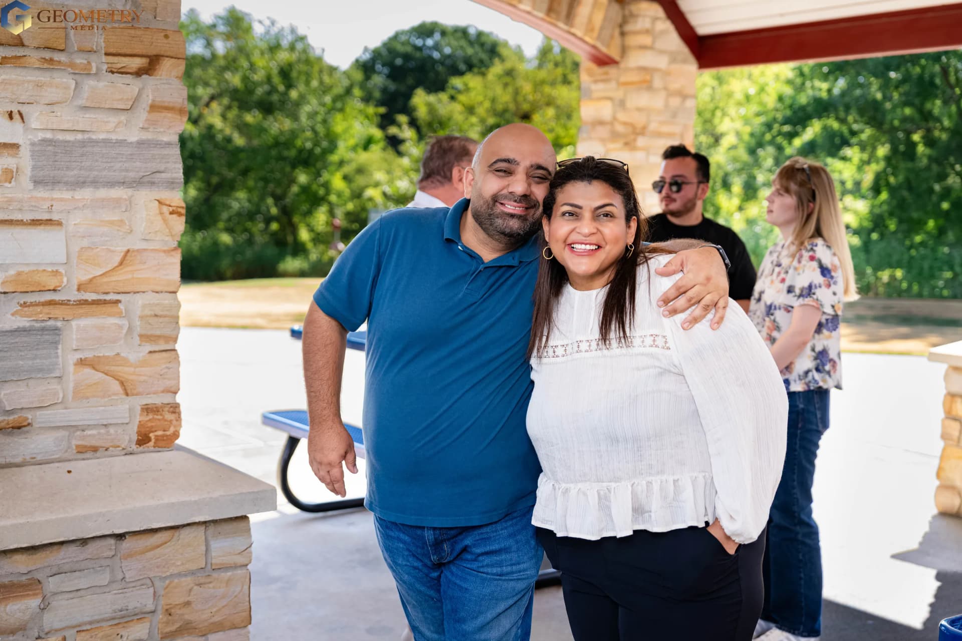 Two guests smile together during the family celebration