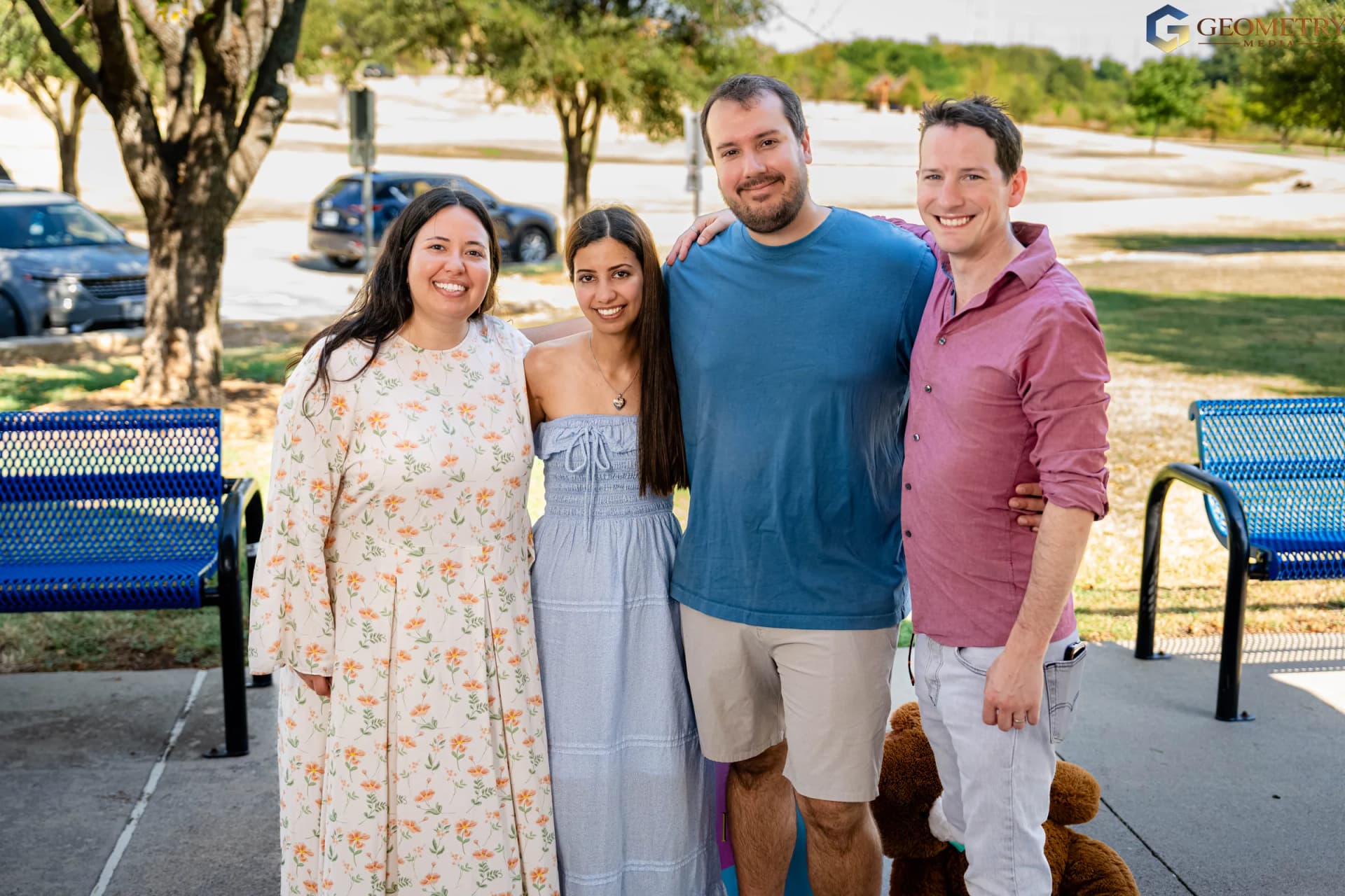 The couple pose with family members after the reveal