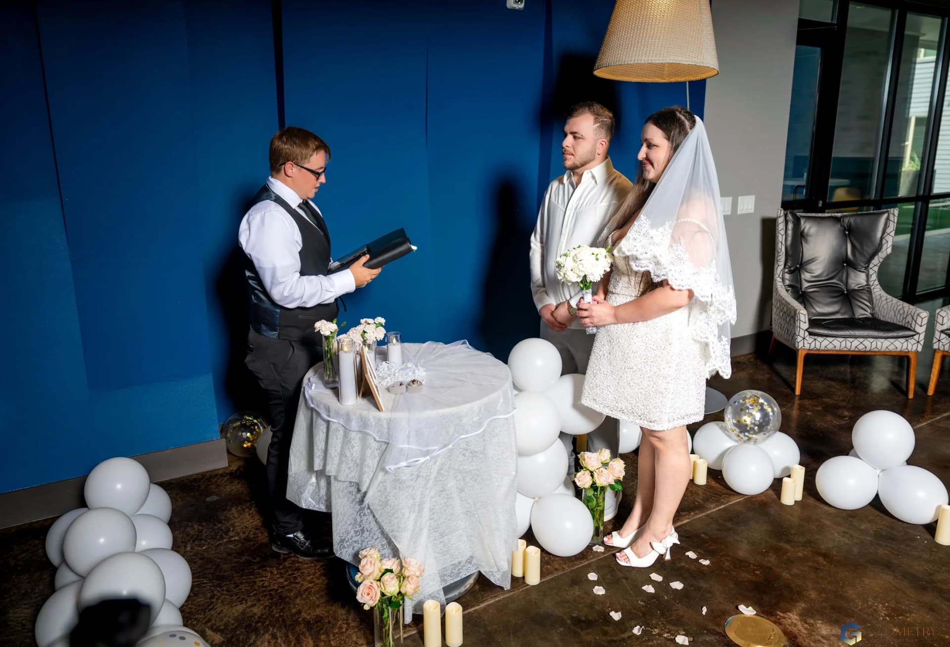 Valentina and Shaiq listening to their officiant