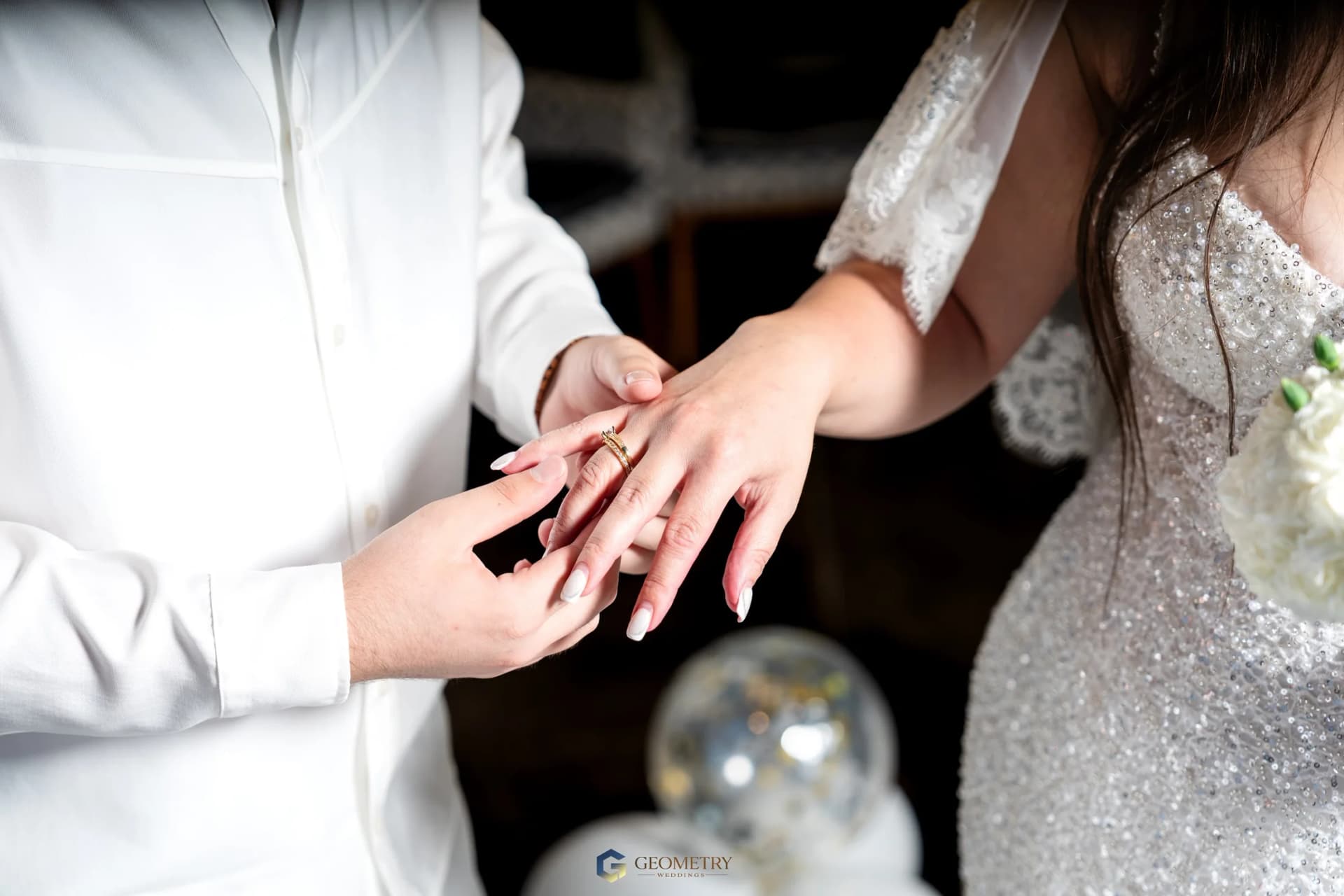 Close detail of the wedding ring exchange