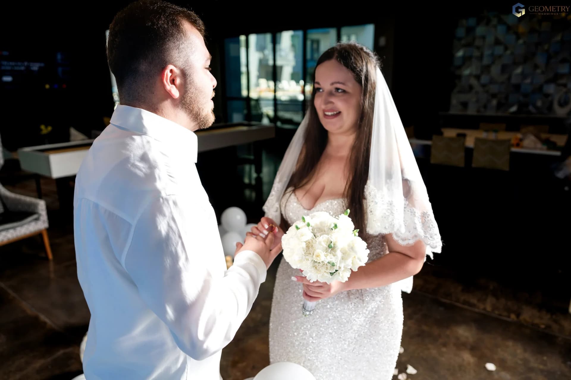 Newlyweds holding hands after their vows