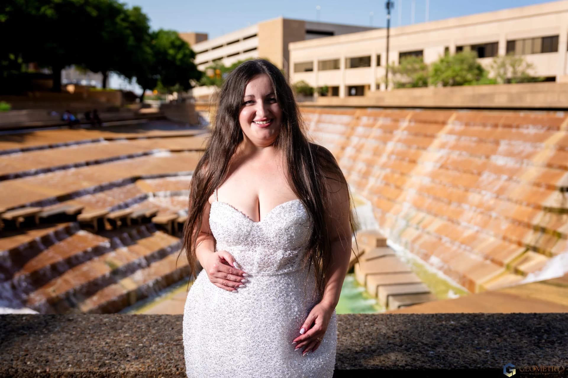 Full-length bridal portrait of Valentina at the Dallas fountain