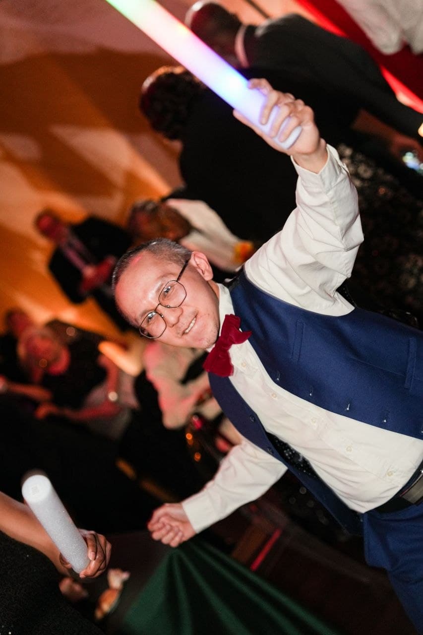 Guest dancing with glow sticks at Dallas wedding reception