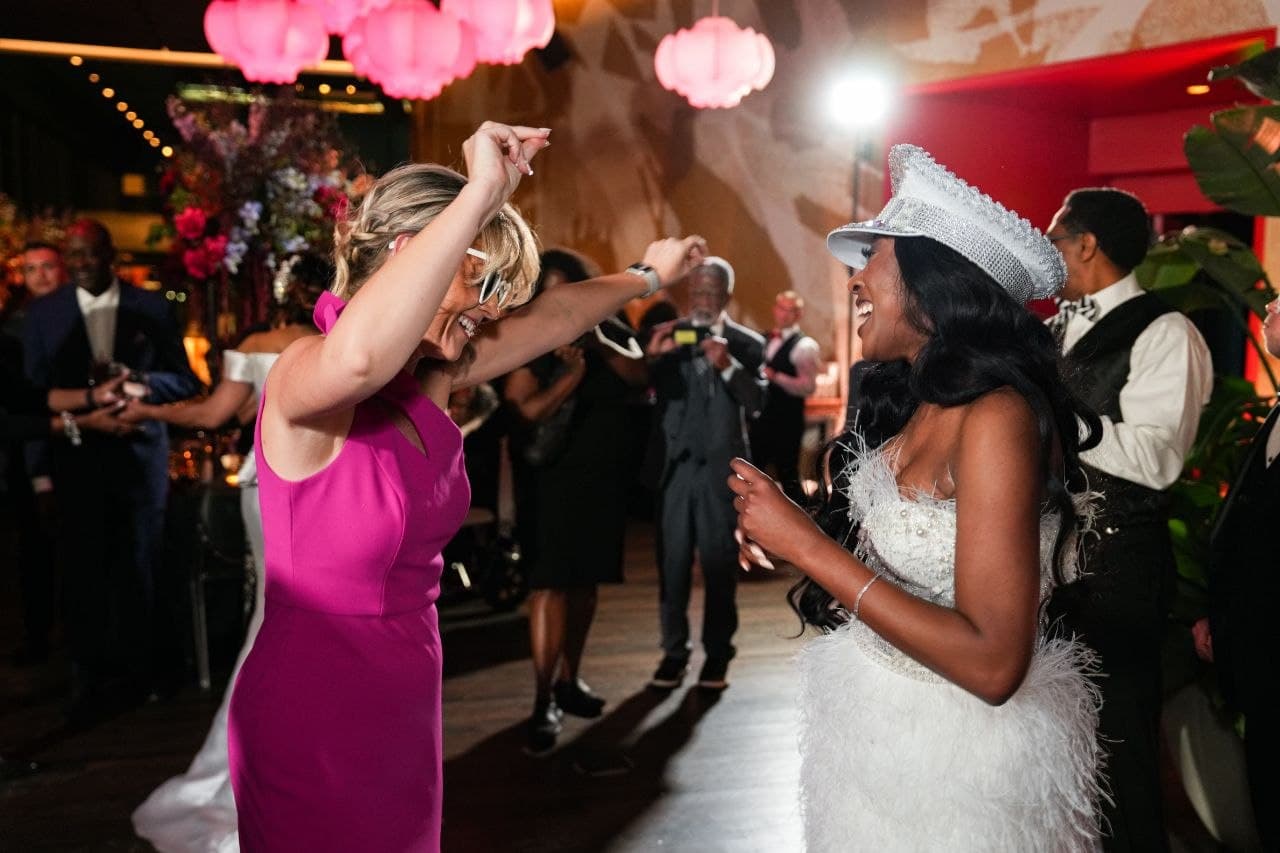 Bride dancing with guests at Dallas wedding reception