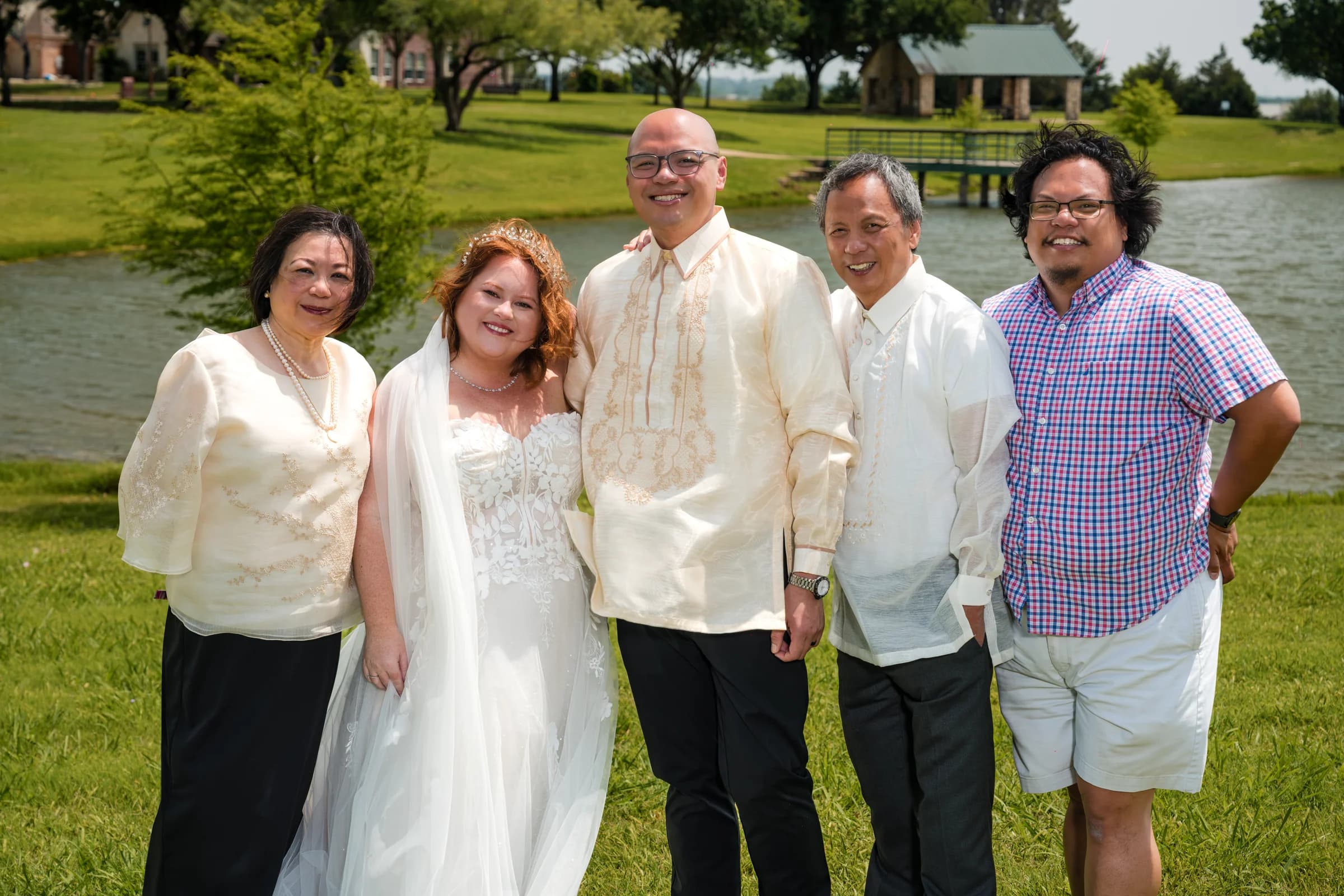 Wide group portrait at outdoor wedding venue
